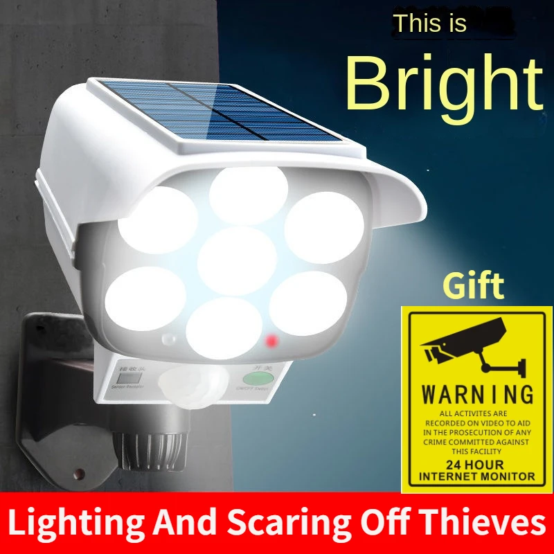 Home Security Group - 屋外ソーラーライトモーションセンサーセキュリティダミーカメラワイヤレスフラッドライトIP65防水77 LEDランプ3モード家庭菜園用